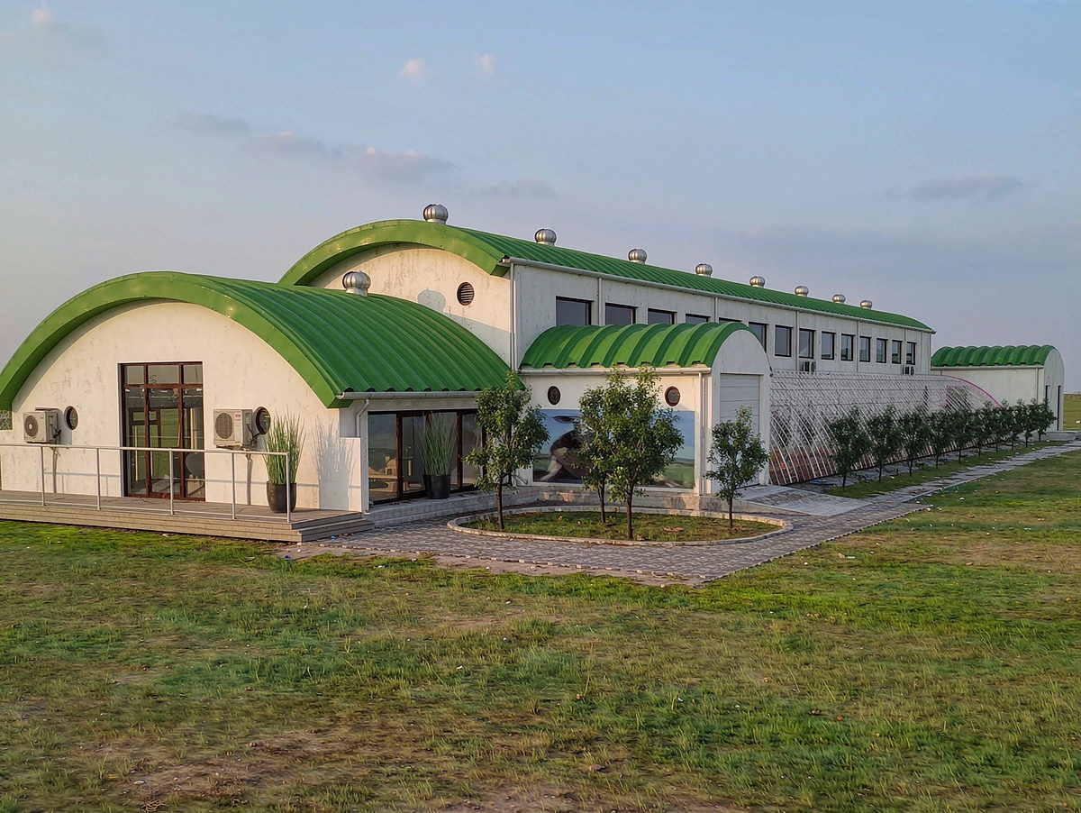 The Argalant cluster farm buildings with green roofs and landscaped grounds