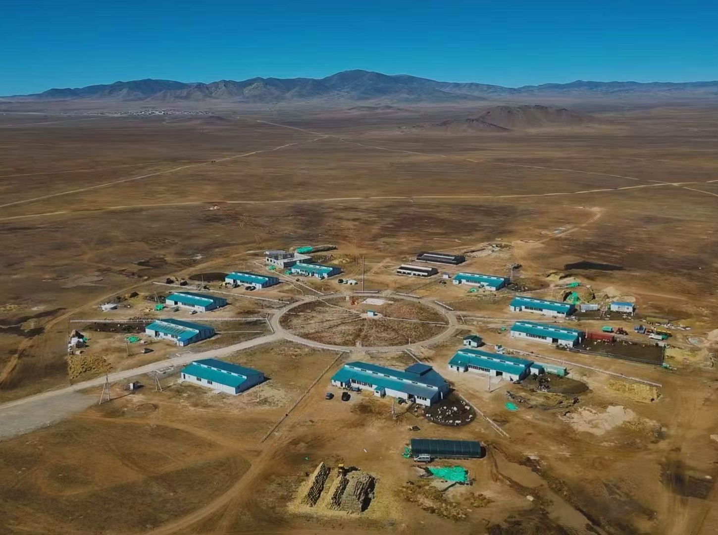Aerial view of the Bayankhangai cluster farm laid out around a central circle